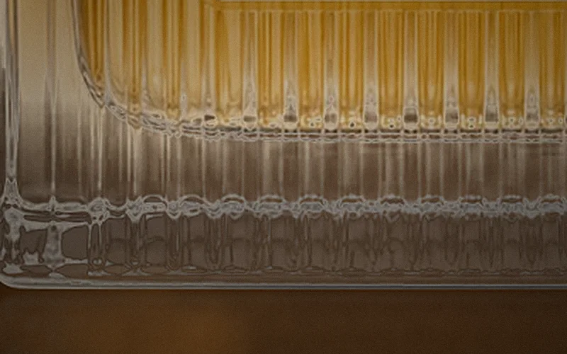Close-up of the thick fluted glass base